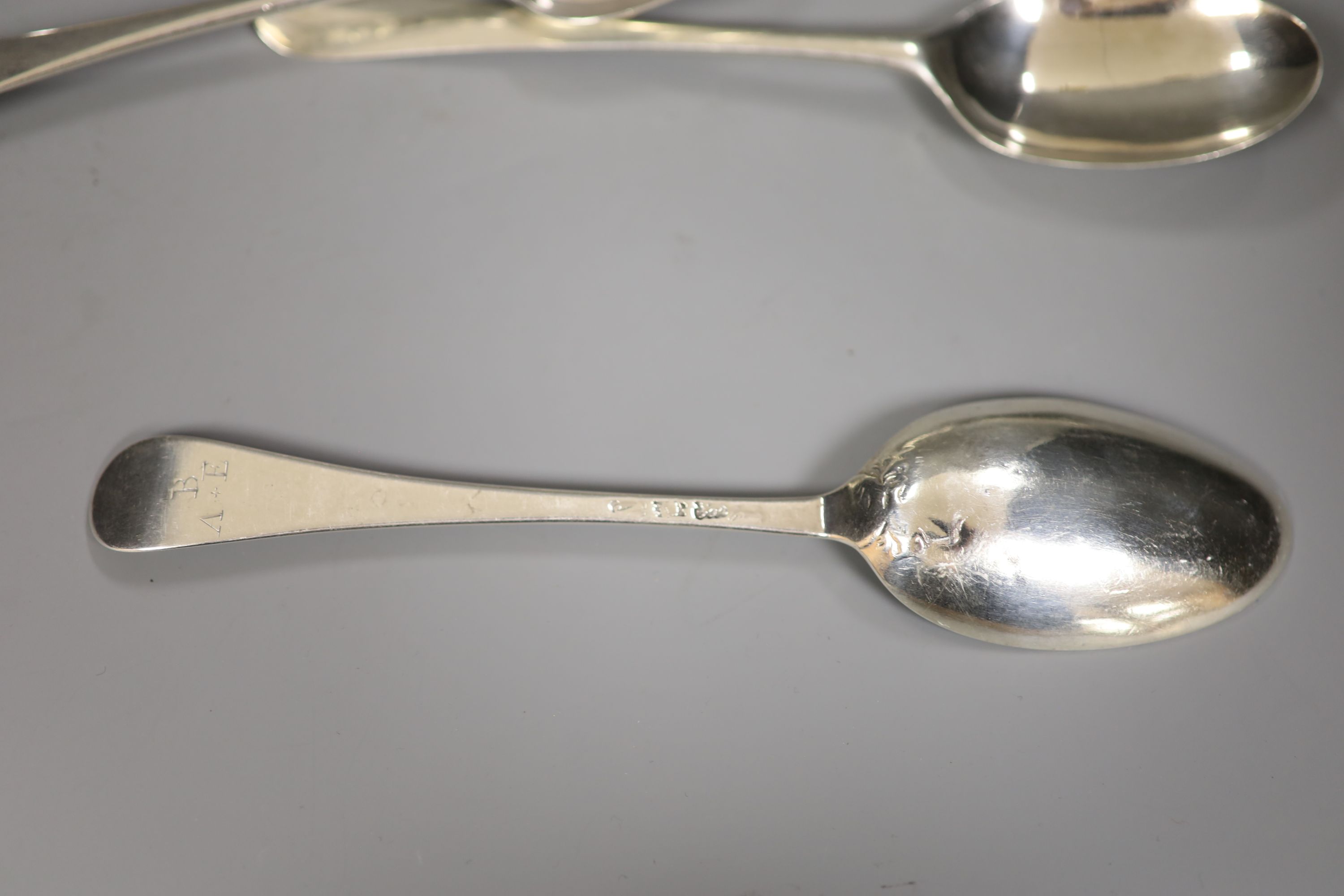 Four 18ct century base marked silver Old English or Hanovarian table spoons including WT, London, 1767, 6.5oz.